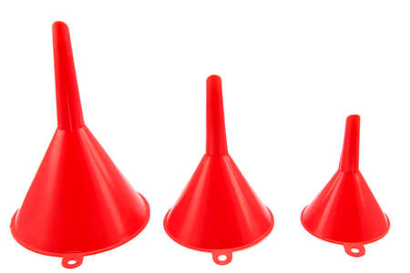 Different size of red plastic funnel isolated on whiteの写真素材