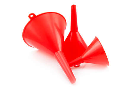 Different size of red plastic funnel isolated on whiteの写真素材