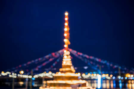 Blured background of building Sand Pagoda and bokeh of bridge background Songkarn Festival Tak ,Thailandの写真素材