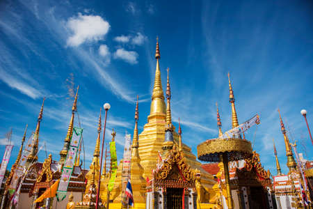 Golden pagoda and blue sky at Phra Borommathat temple Tak Province ,Thailand.の写真素材