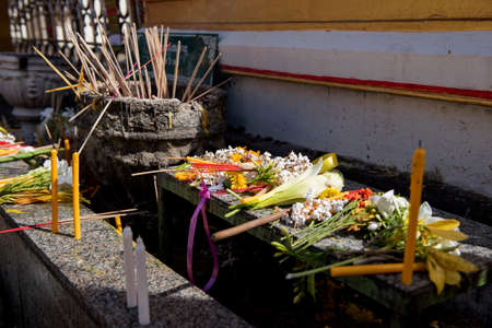 Buddhist people put the flower ,joss stick ,candle and lotus on the table after pray for pagoda Tak ,Thailand.の写真素材