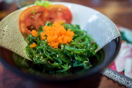 Japanese food seaweed salad topping with ebiko.の写真素材