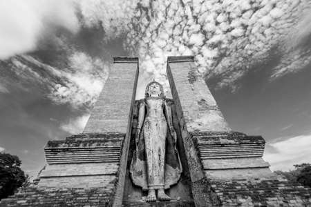 Black and White. Ancient Buddha statue at Sukhothai historical park, Thailand.の写真素材