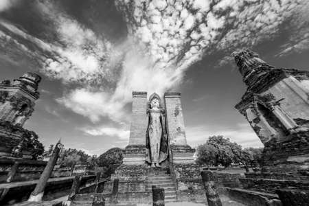 Black and White. Ancient Buddha Statue at Sukhothai historical park, Mahathat Temple ,Thailand.の写真素材
