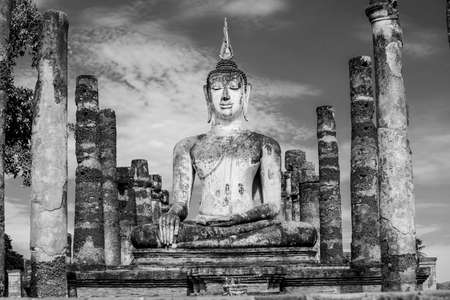 Black and White. Ancient Buddha Statue at Sukhothai historical park, Mahathat Temple ,Thailand.の写真素材