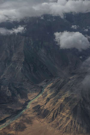 Aerial view of the Shyok river and high mountain from the airplane window. New Delhi-Leh flight ,India.の写真素材