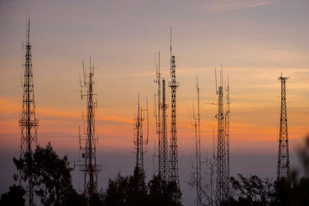 Telecommunications tower at sunrise and blue sky.の写真素材