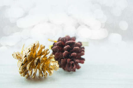 Pinecone on wood floor. Merry Christmas and Happy New Year.