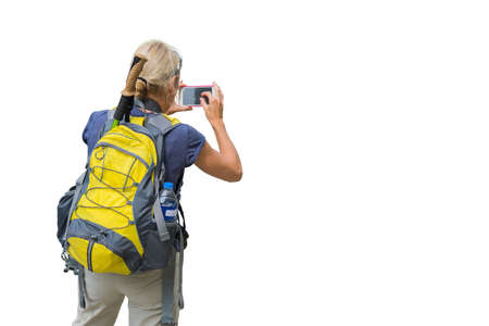 Women backpacker taking photo with smart phone isolated on white background.の写真素材
