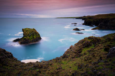 Long exposure Cliffs and basalt rocks in Arnarstapi, Snaefellsnes peninsula in Iceland.