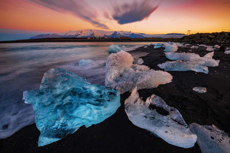 Ice rock on the black sand beach at Diamond Beach, Iceland Summer.