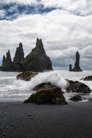 Basalt rock formations Troll toes on black beach. Reynisdrangar, Vik, Iceland