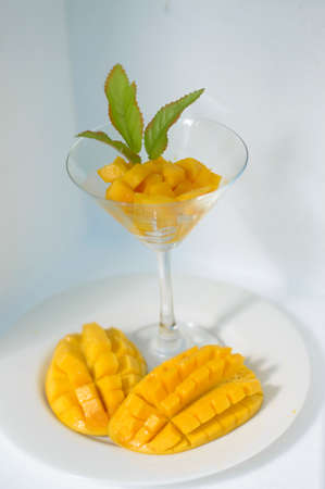Yellow mango isolated on white backgroundの写真素材