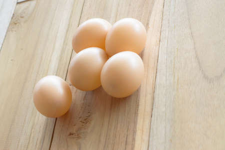 eggs on wood backgroundの写真素材