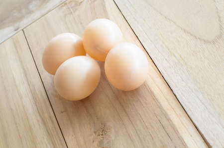 eggs on wood backgroundの写真素材