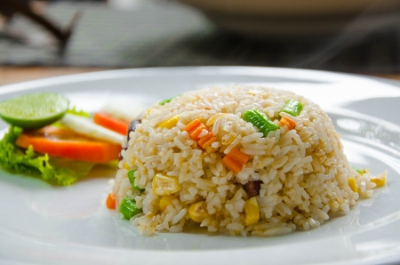 Vegetable Fried rice decorated with tomato and lettuceの写真素材