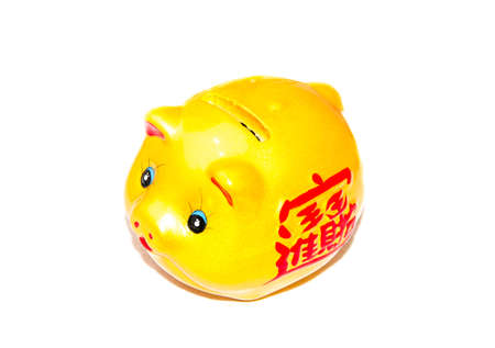Gold piggy coin bank with chinese alphabet on white backgroundの写真素材