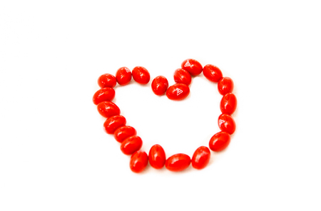 Red medicine arranger to heart shape on white backgroundの写真素材