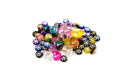 Colorful heart and circle beads on white backgroundの写真素材