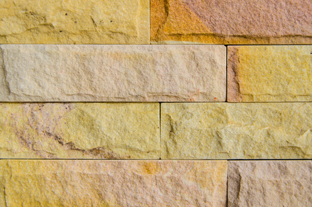 Close up photo of yellow brick wallの写真素材
