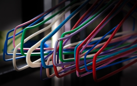 Colorful plastic coat hanger on clothes lineの写真素材