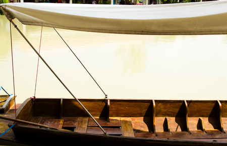 Empty wood row boat  moor on riverの写真素材