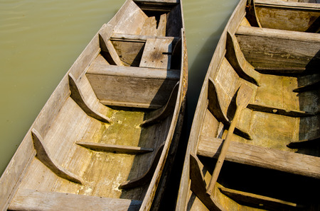 Empty wood row boat  moor on riverの写真素材