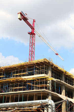 The red crane at a construction site 