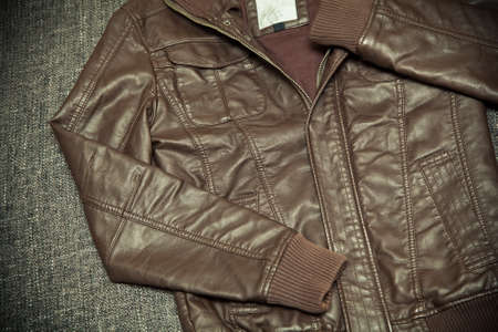 Fashionable leather jacket brown close-up on a dark backgroundの写真素材