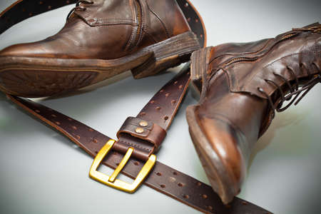 fashionable shoes handmade leather belt with a buckle. grunge styleの写真素材