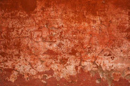 Rough surface concrete walls. Abstract red background. Concrete wall with cracks and scratches. Texture vintage stone surfaceの写真素材