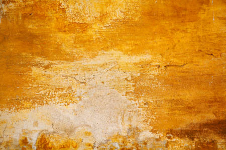 Empty space. Worn rough surface yellow. Old wall. Abstract orange textureの写真素材
