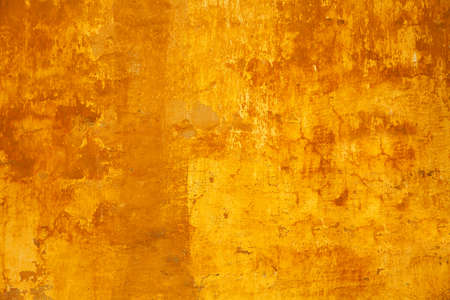 Background texture of the old rough concrete surface yellow. Design basis Background. Empty spaceの写真素材