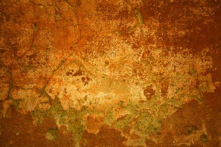 Old concrete texture. Rustic background. Orange red bright wall with cracksの写真素材
