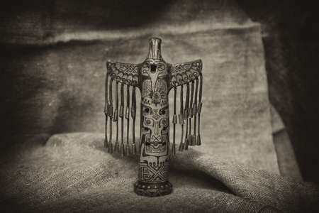 totem in the form of a bird. Vintage styleの写真素材
