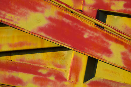 Abstract metal structure closeup of red and yellow. Abstract background, linesの写真素材