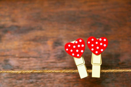 Two hearts on wooden background. Empty spaceの写真素材