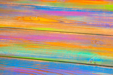 Bright multicolored blank background. Wooden background with colorful paintsの写真素材