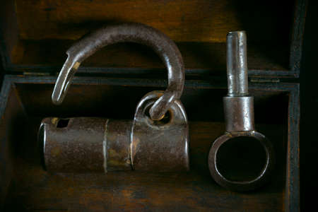 Old metal padlock and key