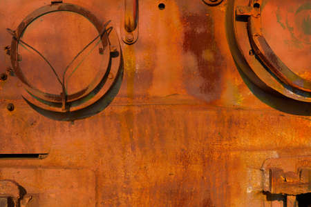 Rusty background. The texture of old metal. Abstract red background in grunge styleの写真素材