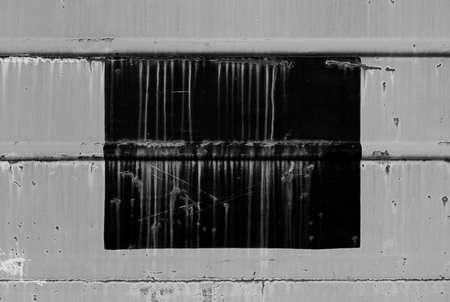 Empty background, old metal texture, black rectangle in the centerの写真素材