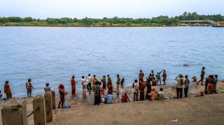 Kolkata, West Bengal, India - June 26, 2019; A group of devotees is preparing to take a bath on the banks of the holy river Ganga (Ganges)のeditorial素材