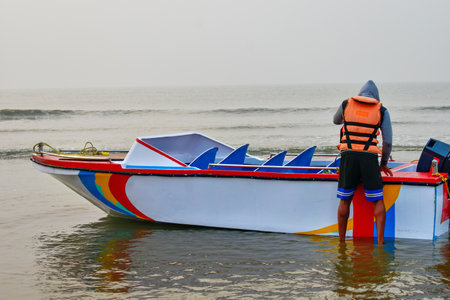 On a winter morning, sailors are preparing to take tourists on a trip to the deep sea with their...
