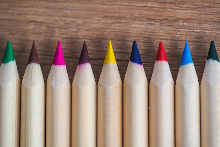 Row of crayons on the tableの写真素材