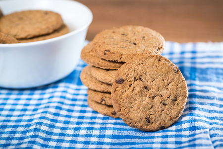 Delicious cookies stacked on a clothの写真素材