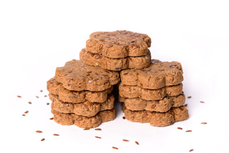 Fresh cookies with dried plums and caraway seeds isolated on the white backgroundの写真素材