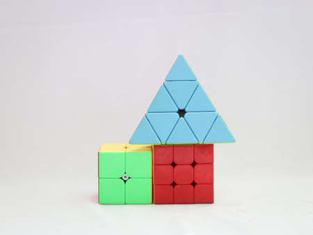 puzzle cubes and pyramid used for increasing problem solving ability  isolated in a white backgroundのeditorial素材