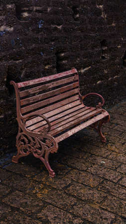 old vintage chair from olden times in a park for people to relax onの写真素材