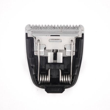 stainless steel shaver blade of a hair clipper or trimmer with springs and plastic attachment isolated in a white background in closeupの写真素材