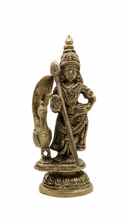 vinatge statue of hindu god of war subramanya, son of lord shiva with his animal, a peacock isolated...
